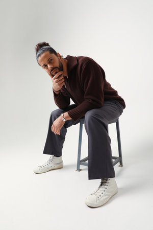 Mind set and mental health. Confident and young man posing in the studio.の写真素材