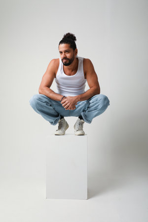 Young handsome man posing in the studio. Mind set and mental health.の写真素材