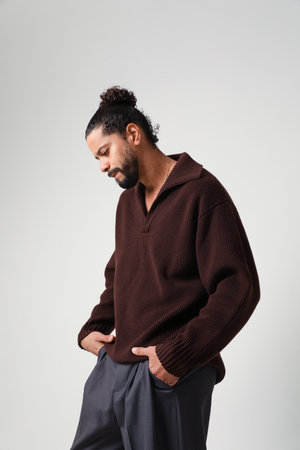 Confident and handsome man posing in the studio. Mind set and mental health.の写真素材