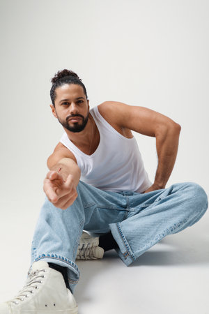 Handsome and young man posing in the studio. Mind set and mental health.の写真素材
