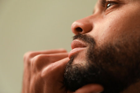 Close-up portrait of man, posing indoor. Mind set and mental health. Vertical.の写真素材