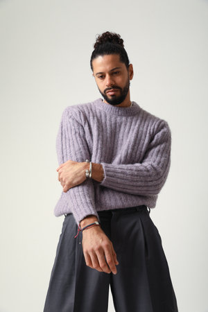 Handsome young man, posing indoor. Mind set and mental health. Vertical.の写真素材