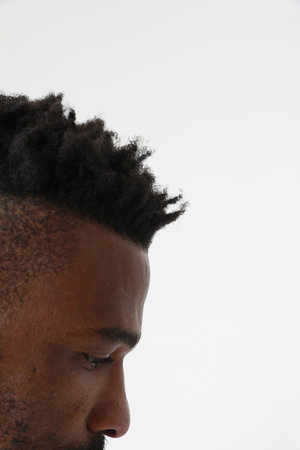 Close-up of serious African American man. Emotions concept.Vertical mock-up