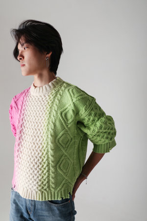 Confident young handsome man posing indoor over white background. Mock-up.の写真素材
