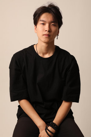 Confident asian man posing on the white background. Mental health issues.の写真素材