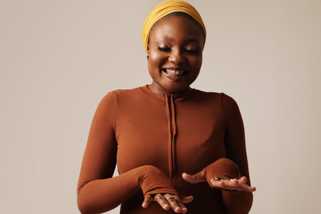 Close-up of happy muslim young woman wearing hijab posing indoor. Mock-up.の写真素材
