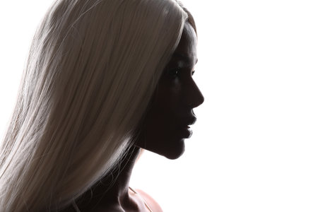 Close-up side view portrait of pretty young afro woman with blond hair. Mock-up.の写真素材