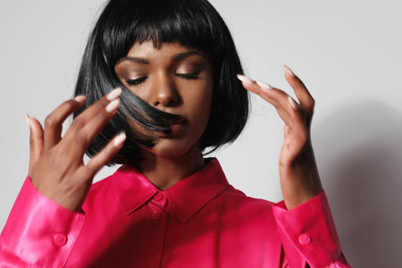 African American young woman with short black hair posing indoor. Mock-up.の写真素材