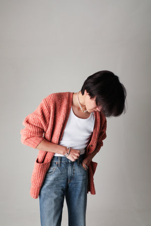 Confident fashion young man posing indoor over white background. Mock-up.の写真素材