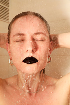 Beautiful caucasian woman taking shower. Healthy lifestyle. Vertical mock-up.の写真素材