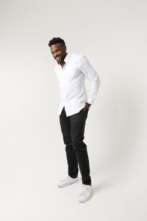 Optimistic African American young man. Good emotions concept. Vertical mock-upの写真素材