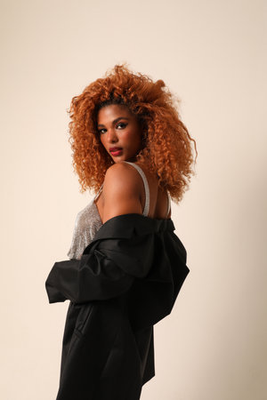 Beautiful young African American woman with afro hairstyle. Vertical mock-up.の写真素材