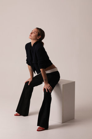 Vertical portrait of young woman posing over white background. Mock-up.の写真素材