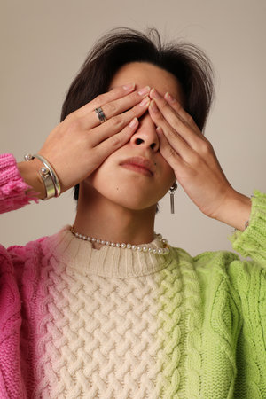 Vertical close-up of young Asian man posing indoor.Mind set and mental health.の写真素材
