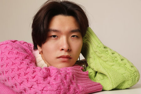 Close-up of young Asian handsome man looking at the camera. Mind-set concept.の写真素材