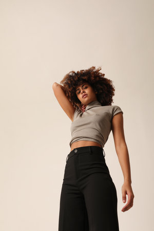 Vertical portrait of beautiful African American young woman with curly hair.