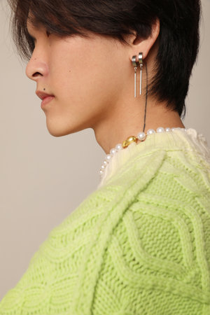 Cropped portrait of man face wears sweater posing indoor. Horizontal mock-up.の写真素材