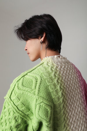 Mind set and mental health. Vertical portrait of young Asian man posing indoor.の写真素材