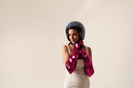 Happy smiling young woman wearing blue biker helmet looking at the camera.の写真素材