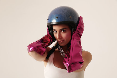 Happy smiling young woman wearing blue biker helmet. Mock-up.の写真素材