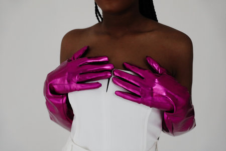 Crop portrait of african woman wearing gloves and elegant white dress. Mock-up.の写真素材