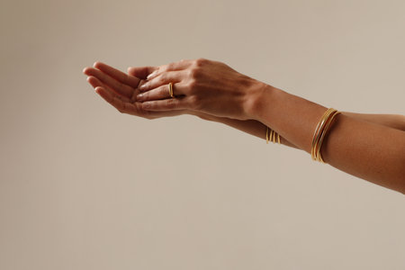 Woman hand posing showing her bracelet. Womens hand with gold bracelet. Mock-upの写真素材