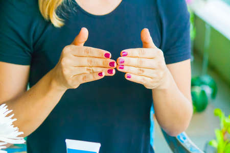 Woman hand applying cream on the other handの写真素材