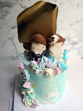 Wedding Cake with bride and groom made with ice creamの写真素材