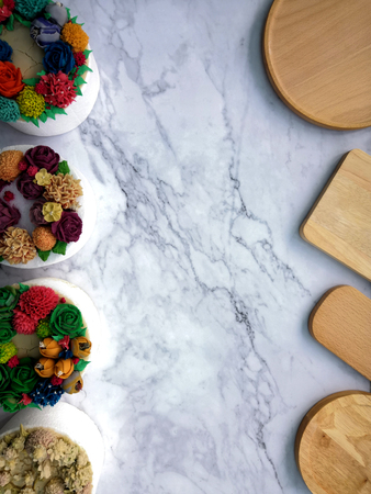 Colourful Flower Cake on Wooden Tableの写真素材