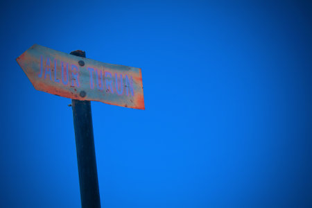 the signpost on the mountain points the way downの写真素材