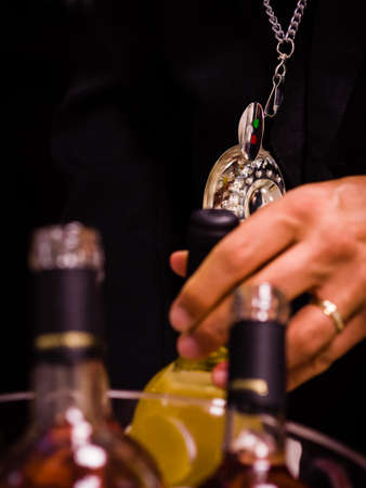 Sommelier with wine bottlesの写真素材