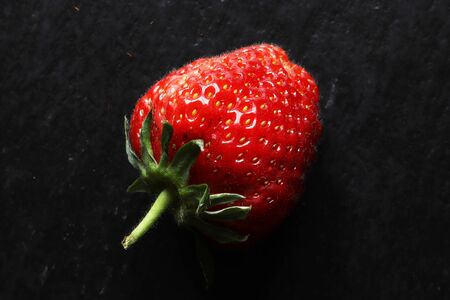 Photography of a strawberry on slate for food backgroundの写真素材