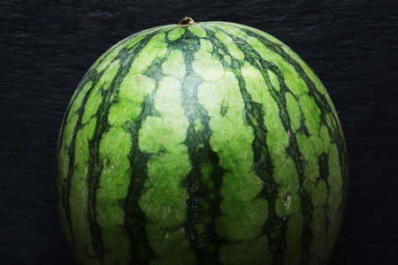 Photography of a watermelon on slate background for food illustationsの写真素材