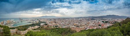 Highly detailed panaoramic view of the city of Malaga, Southern Spain, showing Malaga Port, Cathedral and other major landmarksの写真素材