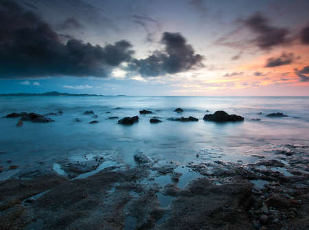 sunset at the reef beachの写真素材
