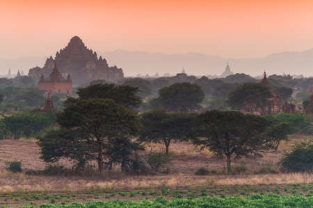 Group of pagoda behind the mist in Bagan after sunset , Myanmarの写真素材