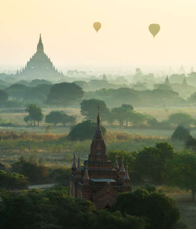 The mist around the ancient temple at Bagan City during sunrise.の写真素材