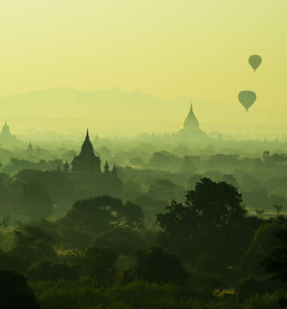 Beautifull scenic sunrise and view of Balloon for tourist at Bagan. Blur background from cloud., Process in color filter for warmness styleの写真素材