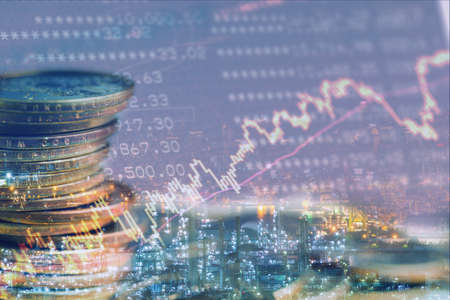 Double exposure of city and row of coins with graph for finance and background
