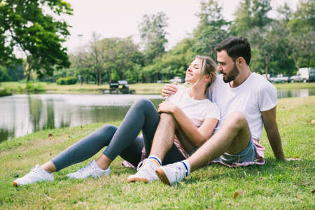 Happy couple on vacation in the parkの写真素材