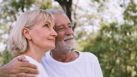 Happy old couple relax in the garden