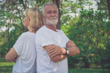 Happy senior couple smiling outdoors in natureの写真素材