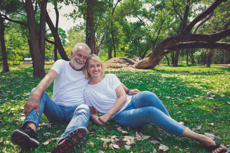 Senior Retirement, Older Couple Enjoy Vacation in the parkの写真素材