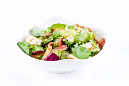 Chicken and bacon with mix of crisp and sweet lettuce leavesの写真素材