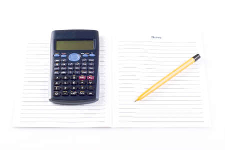 Calculator with notebook and penの写真素材