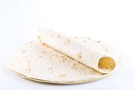 Stack of tortillas with one on the top - isolatedの写真素材