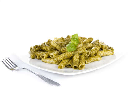 Pasta with pesto sauce  over whiteの写真素材
