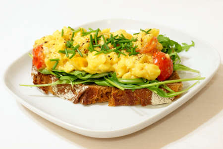 Scrambled eggs on rye breadの写真素材