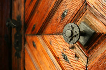 medieval door handle to lock in the backgroundの写真素材