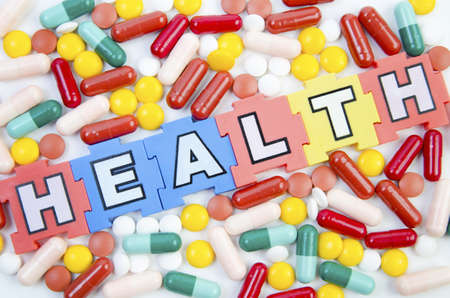 different kinds of medicinal pills in different colorsの写真素材